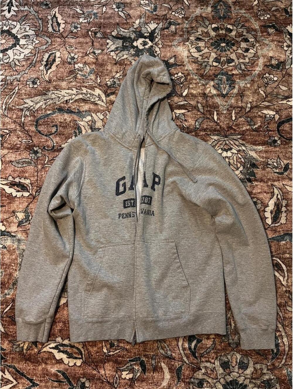 Gray Gap zip up hoodie with black text reading 'GAP EST. 1987 PENNSYLVANIA'